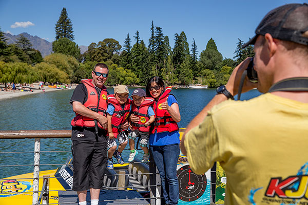 Family photo before jet boating in Queenstown New Zealand