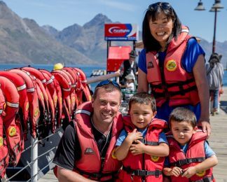 Family photo before jet boating in Queenstown New Zealand