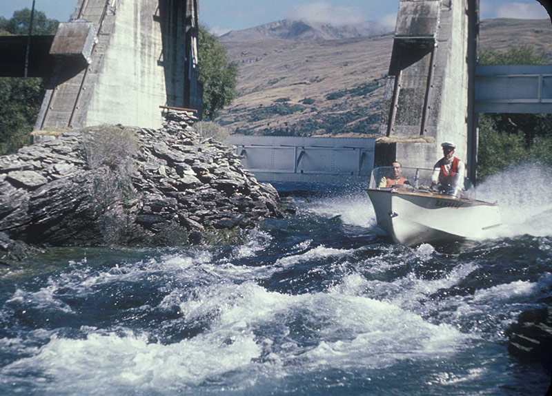 Historic Jet boat under the Kawarau Falls Dam with KJet Queenstown