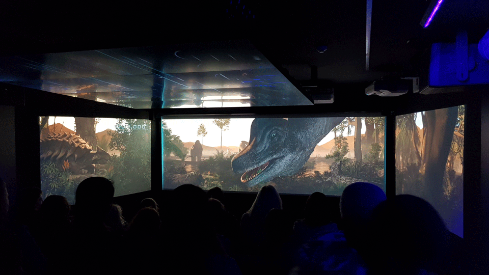 Story of dinosaurs in the Time Tripper underwater theatre with people viewing