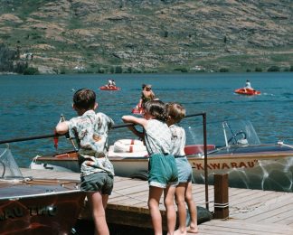 Kawarau and Kawarau Two tied up at the Jetty Kids hanging out at Lake Wakatipu historical Kawarau Jet